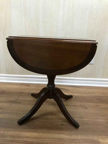 Solid wood folding side table.