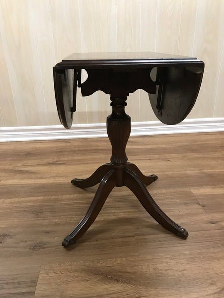 Solid wood folding side table.